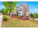 Well maintained townhouse with lawn, flowerbeds, and green trees at 1284 Park Bench Pl, Mableton, GA 30126