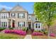 Charming townhome with manicured landscaping and beautiful pink azaleas in the front yard at 1284 Park Bench Pl, Mableton, GA 30126