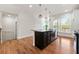 Kitchen with dark island, stainless steel dishwasher, and pendant lighting at 1284 Park Bench Pl, Mableton, GA 30126