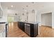 Kitchen with a stainless steel dishwasher, dark island, and ample storage space at 1284 Park Bench Pl, Mableton, GA 30126