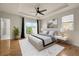 Relaxing main bedroom with tray ceilings, ceiling fan, and balcony access at 1284 Park Bench Pl, Mableton, GA 30126