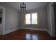 A dining area with hardwood floors and natural light coming in from the window at 1830 W Taylor Ave, Atlanta, GA 30344