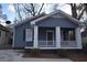 Charming blue house with white trim and porch at 1830 W Taylor Ave, Atlanta, GA 30344