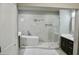 Bathroom features a soaker tub, glass enclosed shower and dark vanity with marble floors at 4863 Amsler Rd, Ellenwood, GA 30294