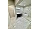 Bathroom features a soaker tub, glass enclosed shower and dark vanity with marble floors at 4863 Amsler Rd, Ellenwood, GA 30294