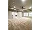 Spacious bedroom features a ceiling fan, tray ceiling and a sliding barn door to the Primary bath at 4863 Amsler Rd, Ellenwood, GA 30294