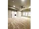 Spacious bedroom features a ceiling fan, tray ceiling and a sliding barn door to the Primary bath at 4863 Amsler Rd, Ellenwood, GA 30294