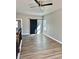 Upstairs bonus room with hardwood flooring and a black sliding barn door at 4863 Amsler Rd, Ellenwood, GA 30294
