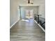 Upstairs bonus room with hardwood flooring, ceiling fan, and access to back deck at 4863 Amsler Rd, Ellenwood, GA 30294
