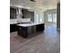 Spacious kitchen featuring a center island, stainless steel appliances, and an adjacent dining area at 4863 Amsler Rd, Ellenwood, GA 30294