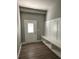 Mudroom features a bench with storage and hooks and an exterior door with a window at 4863 Amsler Rd, Ellenwood, GA 30294