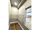 Walk-in pantry with wire racks, a light and a window overlooking the backyard at 4863 Amsler Rd, Ellenwood, GA 30294