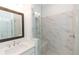 Elegant bathroom with marble shower, built-in bench, and modern vanity at 1442 Casteel Lake Ln # 277, Buford, GA 30518