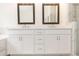 Bathroom boasts double vanity with quartz countertop and dark framed mirrors at 1442 Casteel Lake Ln # 277, Buford, GA 30518