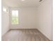 Simple bedroom with neutral walls, carpet, and a window at 1442 Casteel Lake Ln # 277, Buford, GA 30518