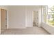 Spacious bedroom with carpet, large windows, and access to closet and bath at 1442 Casteel Lake Ln # 277, Buford, GA 30518