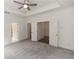 Bright bedroom featuring a ceiling fan and access to other rooms at 1442 Casteel Lake Ln # 277, Buford, GA 30518