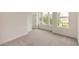 Bright bedroom with large windows and view, featuring carpet floors at 1442 Casteel Lake Ln # 277, Buford, GA 30518