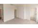 Well-lit bedroom with carpet, doors to bathroom and closet at 1442 Casteel Lake Ln # 277, Buford, GA 30518