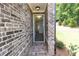 Inviting entryway with brick surround and view into the bright and airy living space at 1442 Casteel Lake Ln # 277, Buford, GA 30518
