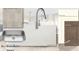 Kitchen design featuring Calacatta Ultra quartz countertops at 1442 Casteel Lake Ln # 277, Buford, GA 30518
