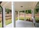 Covered patio with concrete flooring and backyard access at 1442 Casteel Lake Ln # 277, Buford, GA 30518