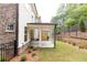 Covered patio with concrete flooring and backyard access at 1442 Casteel Lake Ln # 277, Buford, GA 30518