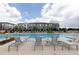 Community pool with plenty of lounge chairs for residents to relax at 1442 Casteel Lake Ln # 277, Buford, GA 30518