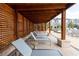 Relaxing lounge chairs under a shaded wooden pergola by the pool at 1442 Casteel Lake Ln # 277, Buford, GA 30518