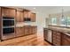 Modern kitchen with double oven and granite countertops at 6620 Flagstone Mill Cv, Cumming, GA 30028