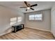 Spacious bedroom with ceiling fan and wood-look flooring at 1606 Fieldgreen Overlook, Stone Mountain, GA 30088