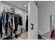 Large walk-in closet with ample hanging and shelf space at 1606 Fieldgreen Overlook, Stone Mountain, GA 30088