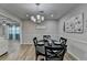 Dining room with table and chairs, view to living room and kitchen at 1606 Fieldgreen Overlook, Stone Mountain, GA 30088