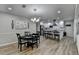 Bright dining room features a round table with seating for six and a view into the kitchen at 1606 Fieldgreen Overlook, Stone Mountain, GA 30088