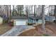 Ranch style home with attached garage and stone accents at 1606 Fieldgreen Overlook, Stone Mountain, GA 30088