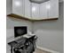 Small home office with desk, chair, and built-in cabinets at 1606 Fieldgreen Overlook, Stone Mountain, GA 30088