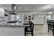 Open concept kitchen with island seating and a view of the living room at 1606 Fieldgreen Overlook, Stone Mountain, GA 30088