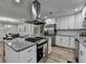 Modern kitchen with stainless steel appliances and granite countertops at 1606 Fieldgreen Overlook, Stone Mountain, GA 30088
