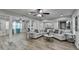 Living area with hardwood floors, sectional sofa and fireplace at 1606 Fieldgreen Overlook, Stone Mountain, GA 30088