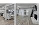 Open living space with hardwood floors, fireplace and large windows at 1606 Fieldgreen Overlook, Stone Mountain, GA 30088