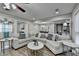 Open concept living room with sectional sofa and hardwood floors at 1606 Fieldgreen Overlook, Stone Mountain, GA 30088
