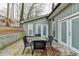 Cozy patio with seating for four, perfect for outdoor dining at 1606 Fieldgreen Overlook, Stone Mountain, GA 30088