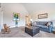 Bonus room with couch, ottoman, and rocking chair at 1567 Brunswick St, Lithia Springs, GA 30122