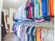 Large walk-in closet with clothing and shoe storage at 1567 Brunswick St, Lithia Springs, GA 30122