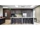 Modern community kitchen with granite counters and bar seating at 1567 Brunswick St, Lithia Springs, GA 30122