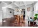 Elegant dining room with a coffered ceiling, hardwood floors, and stylish furniture perfect for gatherings at 1567 Brunswick St, Lithia Springs, GA 30122