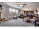Gathering room with carpeted floors, a fireplace and access to the kitchen at 1567 Brunswick St, Lithia Springs, GA 30122