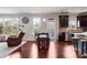 Inviting living area with an eat-in kitchen area featuring modern appliances and dark wood cabinets at 1567 Brunswick St, Lithia Springs, GA 30122