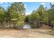 Serene pond view with lush green trees at 1567 Brunswick St, Lithia Springs, GA 30122