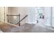 Upstairs hallway with iron railing and carpet at 1567 Brunswick St, Lithia Springs, GA 30122